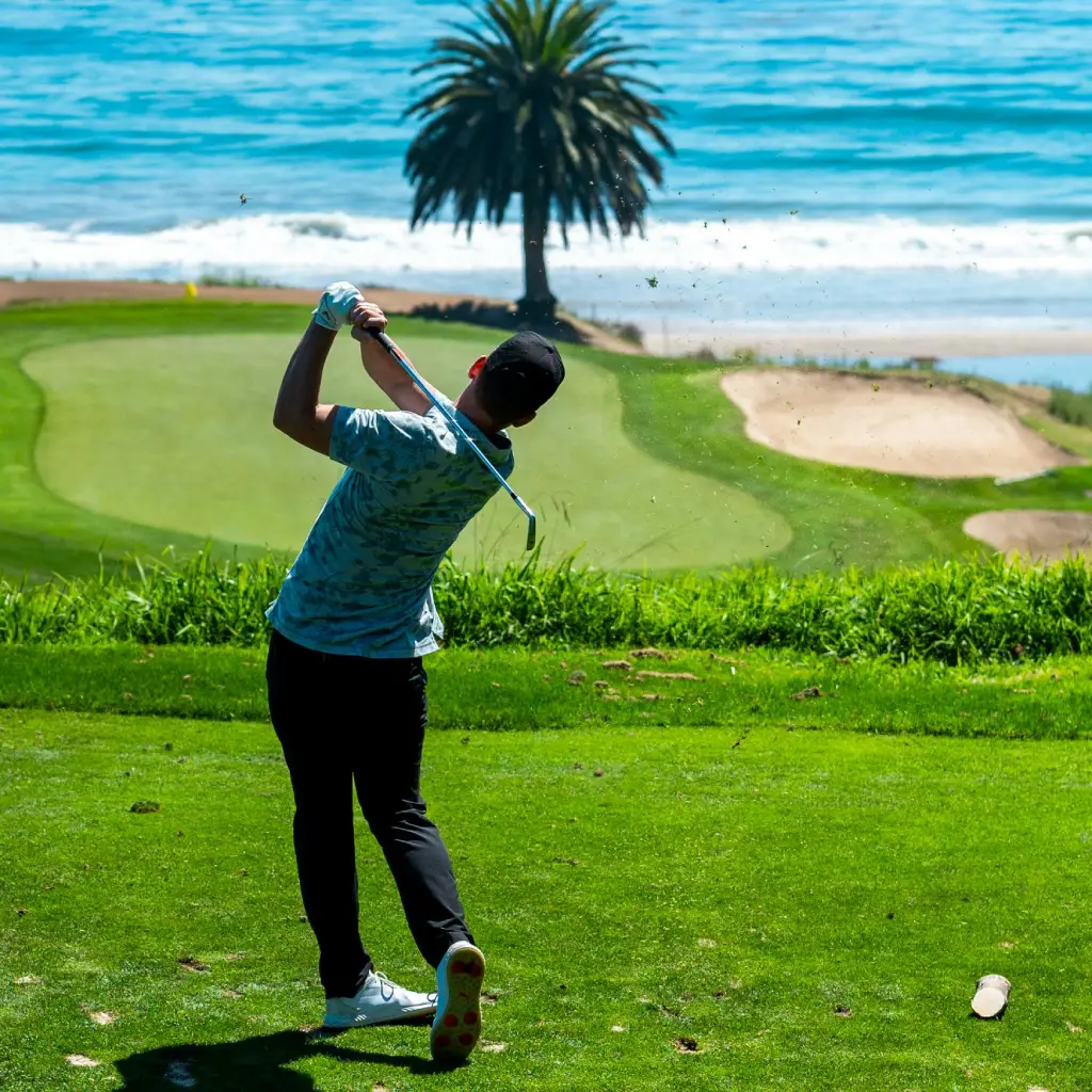 Golf shot on a beachside course with a putter